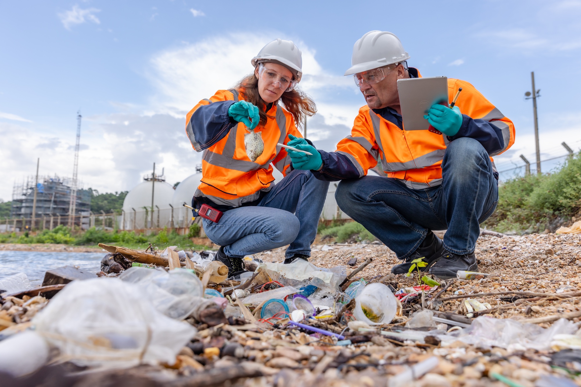 Environmental Scientists Analyzing Plastic Pollution at Shoreline - Waste Management